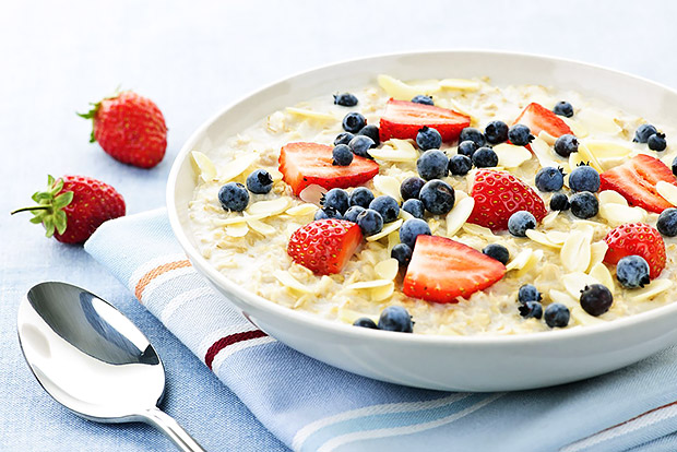 Healthy oatmeal with strawberries, blueberries, and almonds
