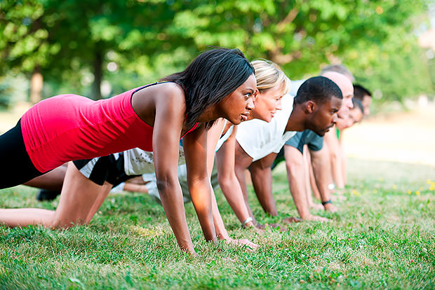 Line of people doing push-ups